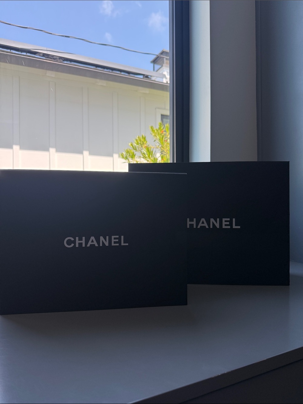 CHANEL Black box and shopping bag